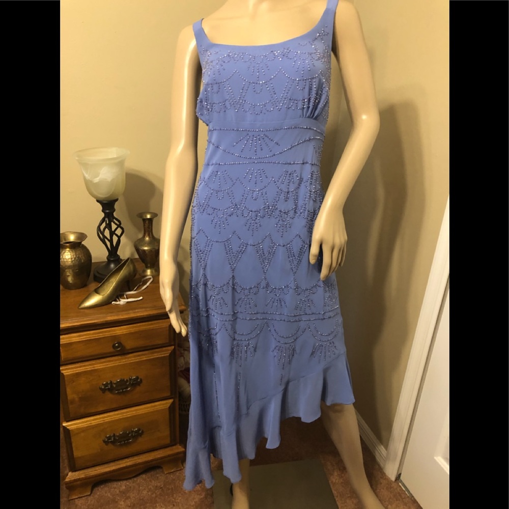 Beautiful beaded high low flutter hem dress.